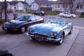 My car next to my Dad's totally badass 1961 Corvette!